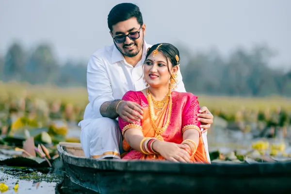 Kerala couple in a country boat on the backwaters